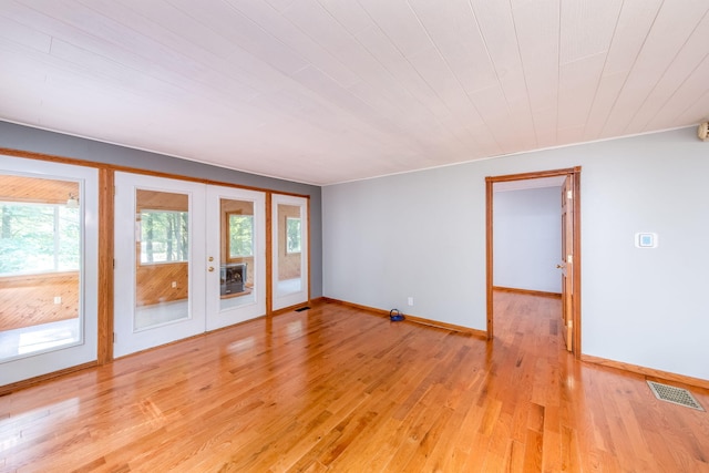 23974 Hooker Dr, Sand Lake, MI 49343 - spare room featuring french doors, light wood-style flooring, and wood ceiling
