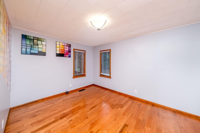 23974 Hooker Dr, Sand Lake, MI 49343 - empty room featuring light wood-style flooring and baseboards