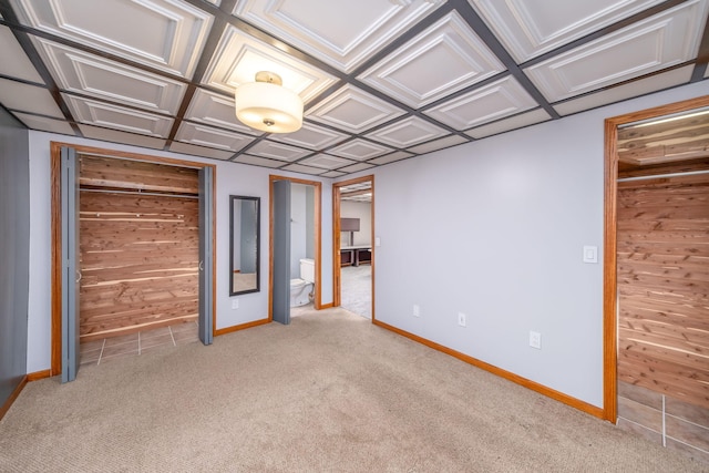 23974 Hooker Dr, Sand Lake, MI 49343 - unfurnished bedroom featuring light colored carpet and wood walls