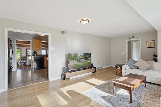 806 10th St, Plainwell, MI 49080 - living room with light wood-style flooring