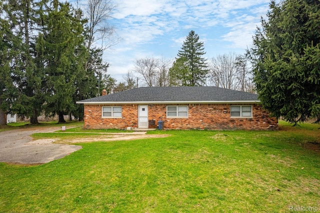 10685 Dixie Hwy, Davisburg, MI 48350 - ranch-style home with a chimney, a front lawn, and brick siding