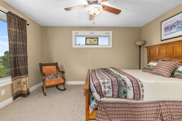 9752 Jackson Rd, Clarksville, MI 48815 - carpeted bedroom featuring baseboards and a ceiling fan