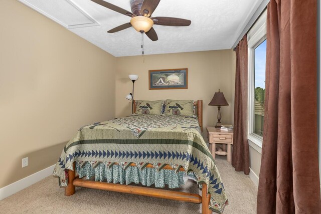 9752 Jackson Rd, Clarksville, MI 48815 - carpeted bedroom featuring baseboards and a ceiling fan