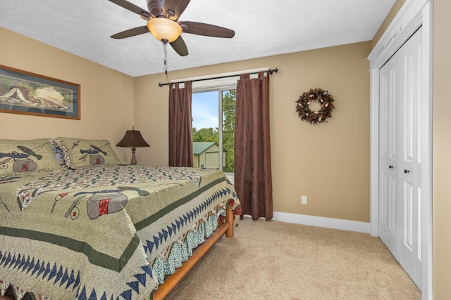 9752 Jackson Rd, Clarksville, MI 48815 - bedroom with a closet, carpet floors, a ceiling fan, and access to outside