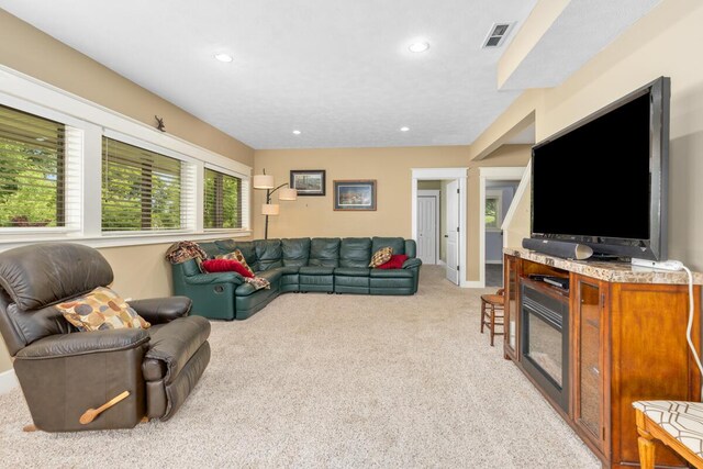 9752 Jackson Rd, Clarksville, MI 48815 - living room featuring light colored carpet and recessed lighting