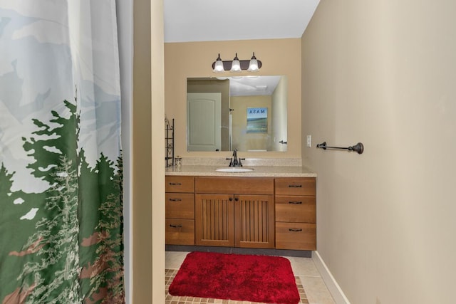 9752 Jackson Rd, Clarksville, MI 48815 - bathroom with vanity and tile patterned flooring