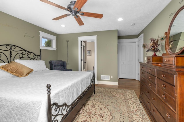 9752 Jackson Rd, Clarksville, MI 48815 - bedroom with wood finished floors, recessed lighting, a ceiling fan, and connected bathroom