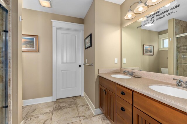 9752 Jackson Rd, Clarksville, MI 48815 - bathroom featuring double vanity and a shower stall