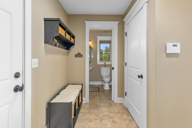 9752 Jackson Rd, Clarksville, MI 48815 - mudroom with baseboards