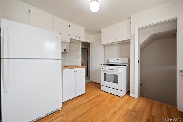 8220 Hartwell St, Detroit, MI 48228 - kitchen with white appliances, backsplash, white cabinets, and light wood finished floors