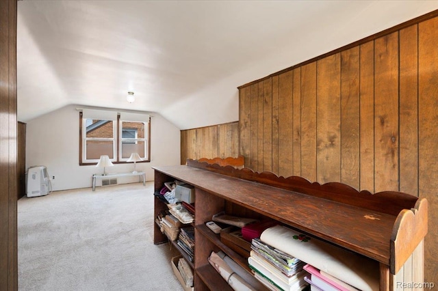 8220 Hartwell St, Detroit, MI 48228 - hallway featuring light carpet, vaulted ceiling, and wood walls