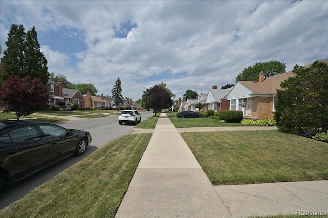 8220 Hartwell St, Detroit, MI 48228 - view of asphalt street with a residential view and sidewalks