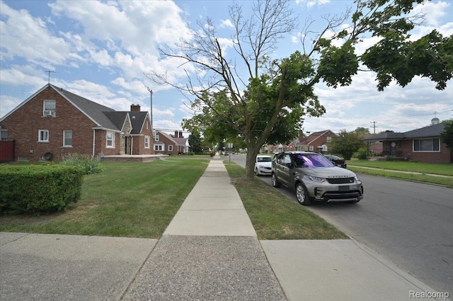 8220 Hartwell St, Detroit, MI 48228 - view of asphalt street featuring sidewalks, a residential view, and curbs