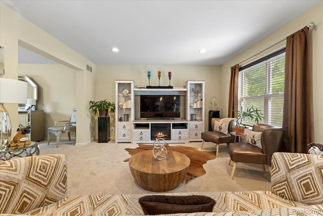 14236 Marshall Dr, Redford, MI 48239 - carpeted living room featuring a lit fireplace and recessed lighting