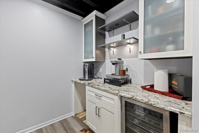 14236 Marshall Dr, Redford, MI 48239 - indoor dry bar featuring wood finished floors, crown molding, and beverage cooler
