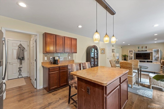 14236 Marshall Dr, Redford, MI 48239 - kitchen featuring dark wood-style flooring, decorative backsplash, a center island, pendant lighting, and recessed lighting