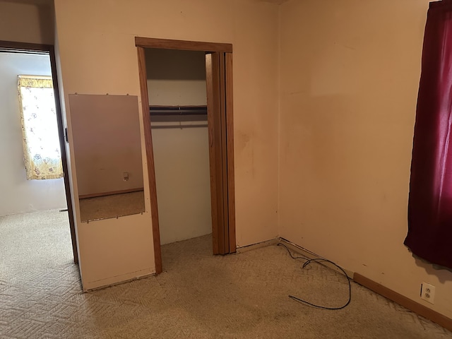 8942 28th Ave, Bitely, MI 49309 - unfurnished bedroom featuring light colored carpet and a closet