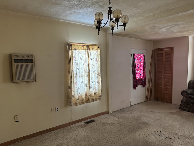 8942 28th Ave, Bitely, MI 49309 - spare room featuring a chandelier, carpet, heating unit, and a textured ceiling