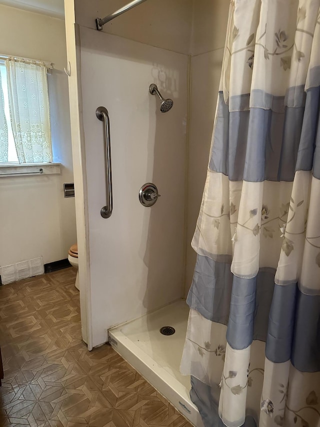 8942 28th Ave, Bitely, MI 49309 - bathroom with a stall shower and toilet