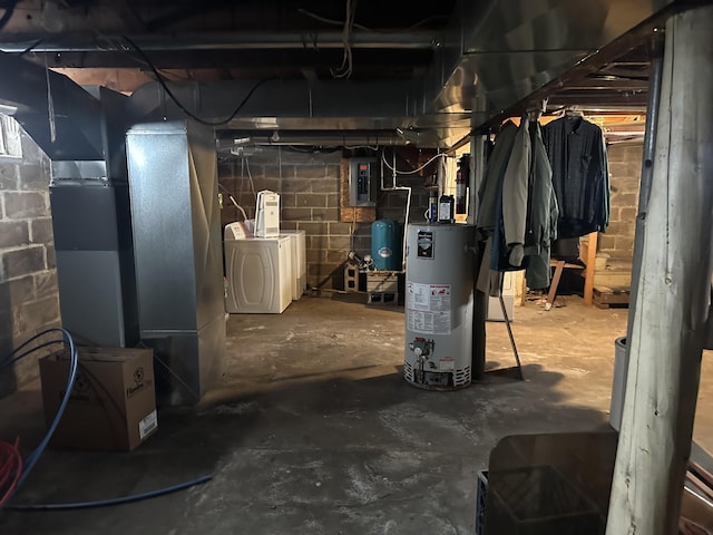 8942 28th Ave, Bitely, MI 49309 - unfinished basement with gas water heater, washer and dryer, a water pressure tank, and electric panel