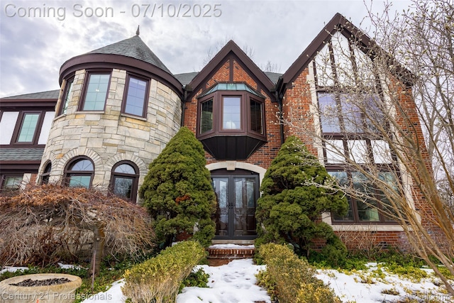 1180 Knob Creek Dr, Rochester, MI 48306 - view of front facade with french doors, stone siding, and brick siding