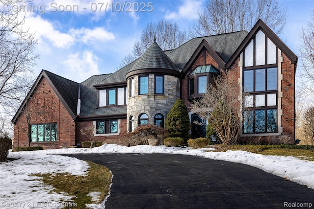 1180 Knob Creek Dr, Rochester, MI 48306 - view of front of home with brick siding, a high end roof, and stone siding