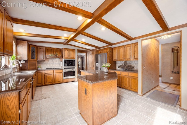 1180 Knob Creek Dr, Rochester, MI 48306 - kitchen with stainless steel appliances, tasteful backsplash, brown cabinets, a center island, and recessed lighting