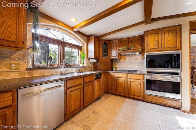 1180 Knob Creek Dr, Rochester, MI 48306 - kitchen with stainless steel appliances, brown cabinets, tasteful backsplash, custom range hood, and light tile patterned flooring