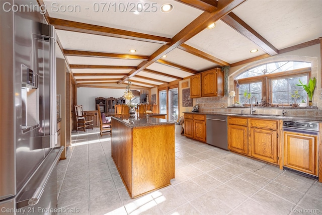 1180 Knob Creek Dr, Rochester, MI 48306 - kitchen with stainless steel appliances, a center island, brown cabinetry, dark countertops, and backsplash
