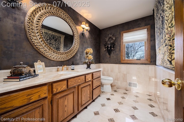 1180 Knob Creek Dr, Rochester, MI 48306 - bathroom with vanity, a wainscoted wall, tile patterned floors, and tile walls