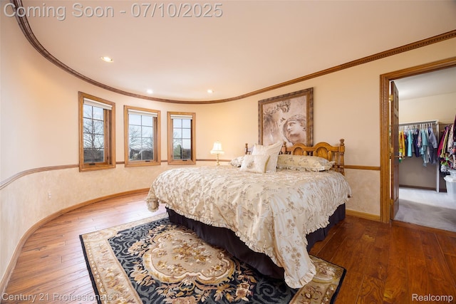 1180 Knob Creek Dr, Rochester, MI 48306 - bedroom with light wood-style flooring, ornamental molding, recessed lighting, a spacious closet, and a closet