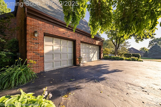 1180 Knob Creek Dr, Rochester, MI 48306 - garage with asphalt driveway