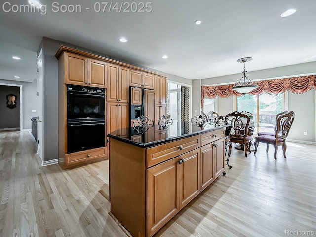 926 Majestic, Rochester Hills, MI 48306 - kitchen featuring paneled fridge, light wood-style flooring, a center island, recessed lighting, and decorative light fixtures