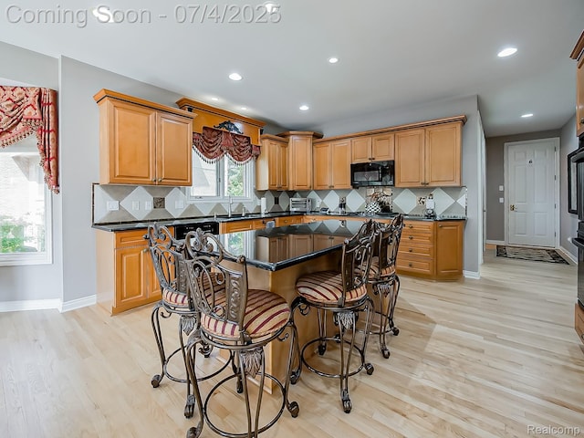 926 Majestic, Rochester Hills, MI 48306 - kitchen with black microwave, light wood finished floors, decorative backsplash, and recessed lighting