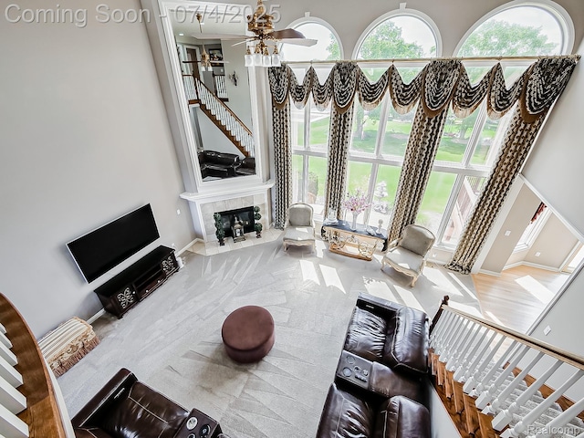 926 Majestic, Rochester Hills, MI 48306 - carpeted living room featuring a high ceiling, ceiling fan, and a fireplace