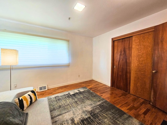 3374 Elmwood St, Clio, MI 48420 - bedroom featuring wood finished floors and a closet
