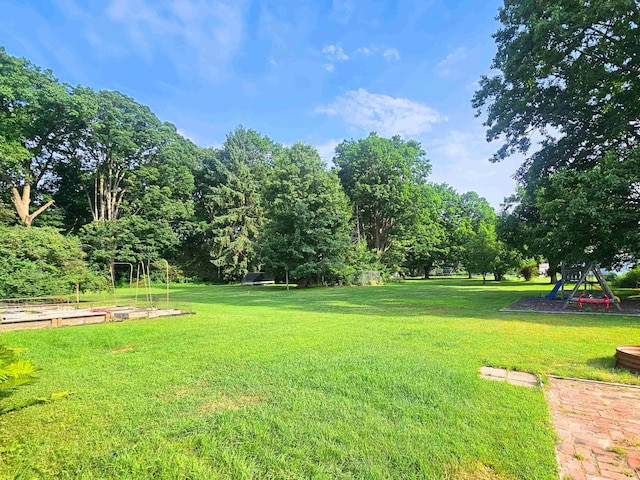 3374 Elmwood St, Clio, MI 48420 - view of grassy yard featuring a garden