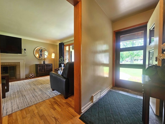 3374 Elmwood St, Clio, MI 48420 - entryway with a fireplace and wood finished floors