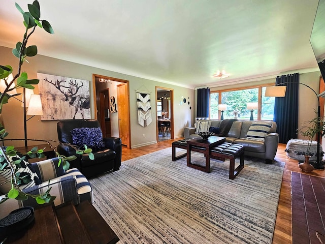 3374 Elmwood St, Clio, MI 48420 - living room featuring wood finished floors and baseboards