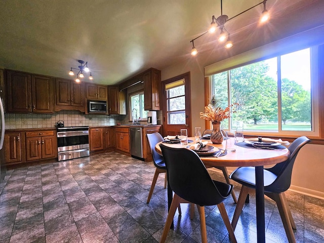 3374 Elmwood St, Clio, MI 48420 - dining area featuring baseboards