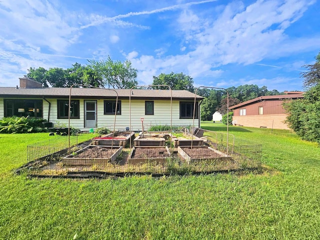 3374 Elmwood St, Clio, MI 48420 - back of house with a garden, a yard, and a chimney