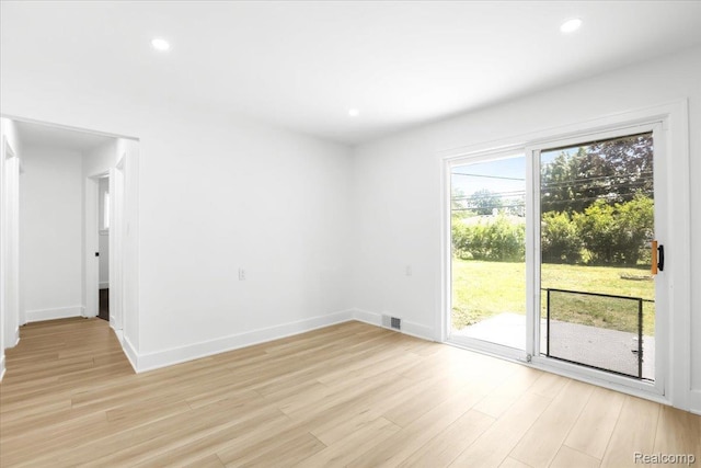 22266 E Schafer St, Clinton Township, MI 48035 - spare room featuring light wood-style flooring and recessed lighting