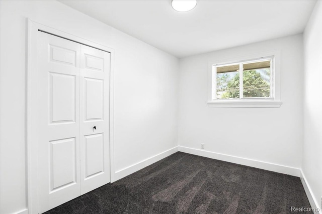 22266 E Schafer St, Clinton Township, MI 48035 - unfurnished bedroom featuring dark carpet and a closet
