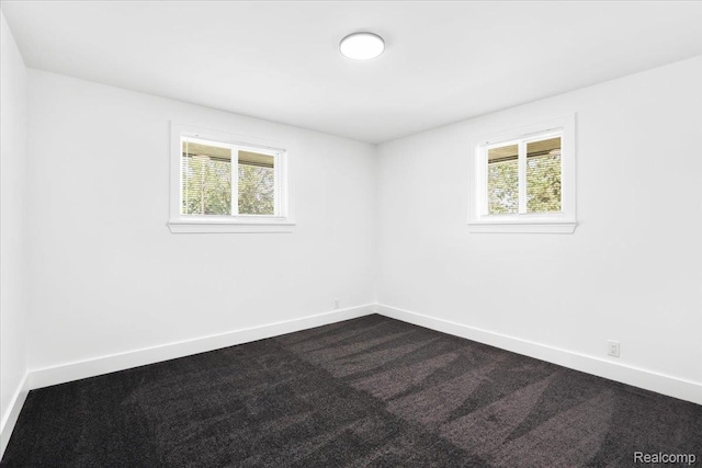 22266 E Schafer St, Clinton Township, MI 48035 - spare room with healthy amount of natural light and dark colored carpet