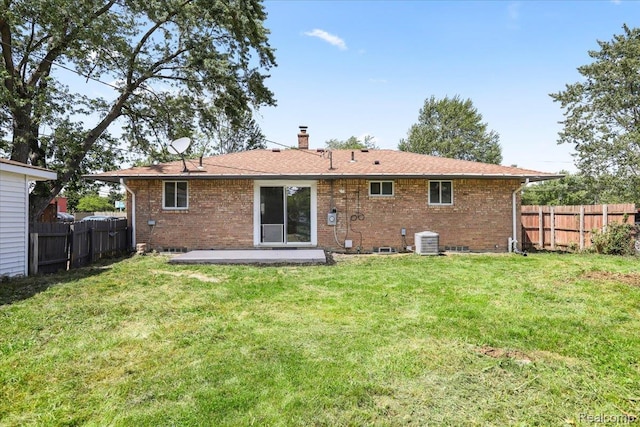 22266 E Schafer St, Clinton Township, MI 48035 - rear view of house featuring brick siding, a patio, and a chimney