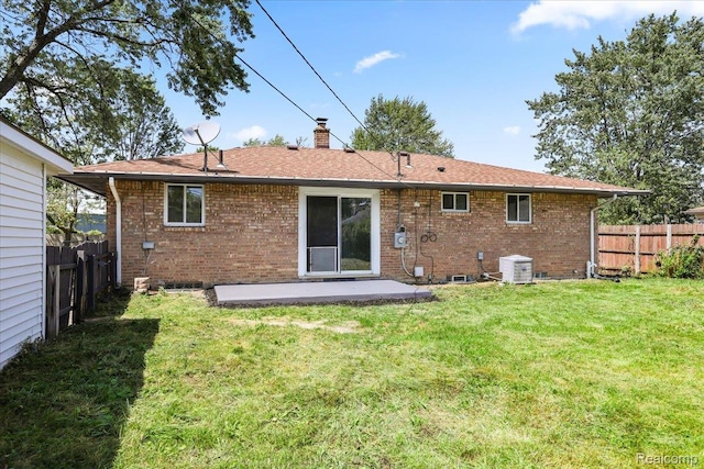22266 E Schafer St, Clinton Township, MI 48035 - back of house featuring a fenced backyard, brick siding, and a chimney