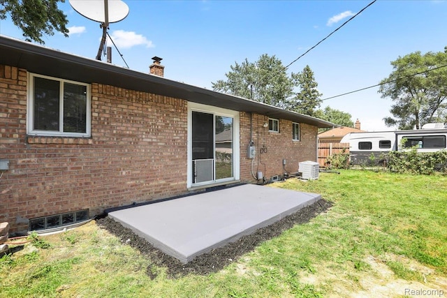 22266 E Schafer St, Clinton Township, MI 48035 - rear view of property featuring a patio, brick siding, and a chimney