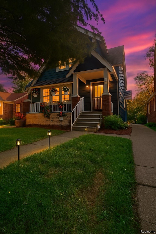 13516 Mansfield St, Detroit, MI 48227 - craftsman-style house with covered porch and a front lawn