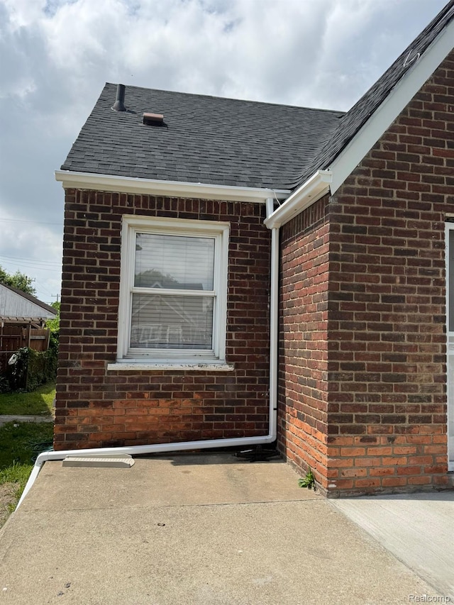 2544 S Beatrice St, Detroit, MI 48217 - doorway to property with brick siding and roof with shingles