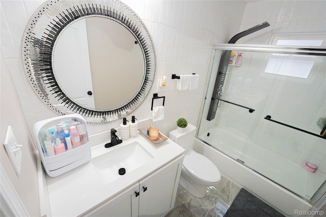 2544 S Beatrice St, Detroit, MI 48217 - full bathroom with shower / bath combination with glass door, vanity, and tile walls